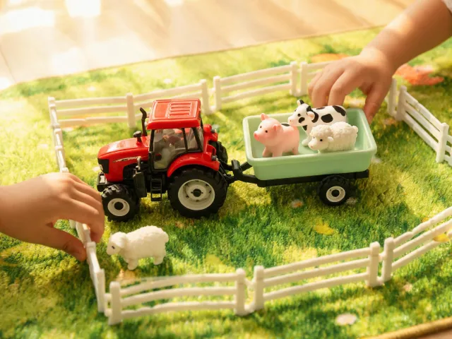 Farm play with toy tractor and animals